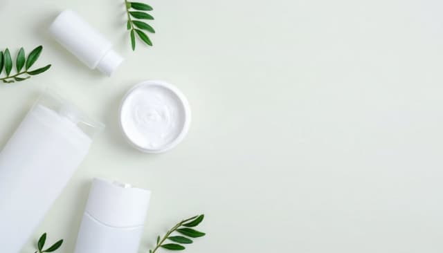 Various aluminium-free deodorant products from Australian brands including paste, stick, and spray formats arranged on a bathroom counter